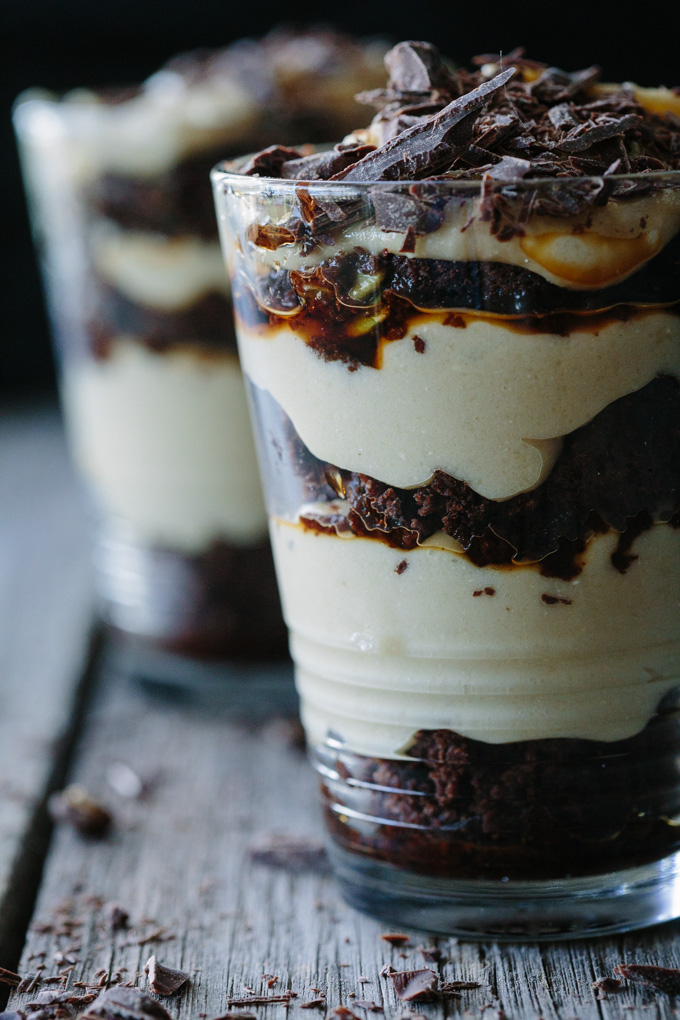A super close up image of the different layers of the tiramisu in a glass