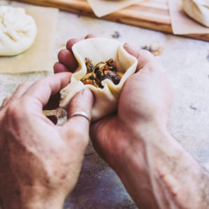 A man making a bao bun
