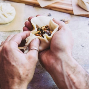 A man making a bao bun