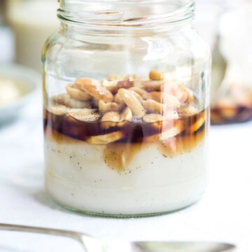 A jar of banana panna cotta with nuts