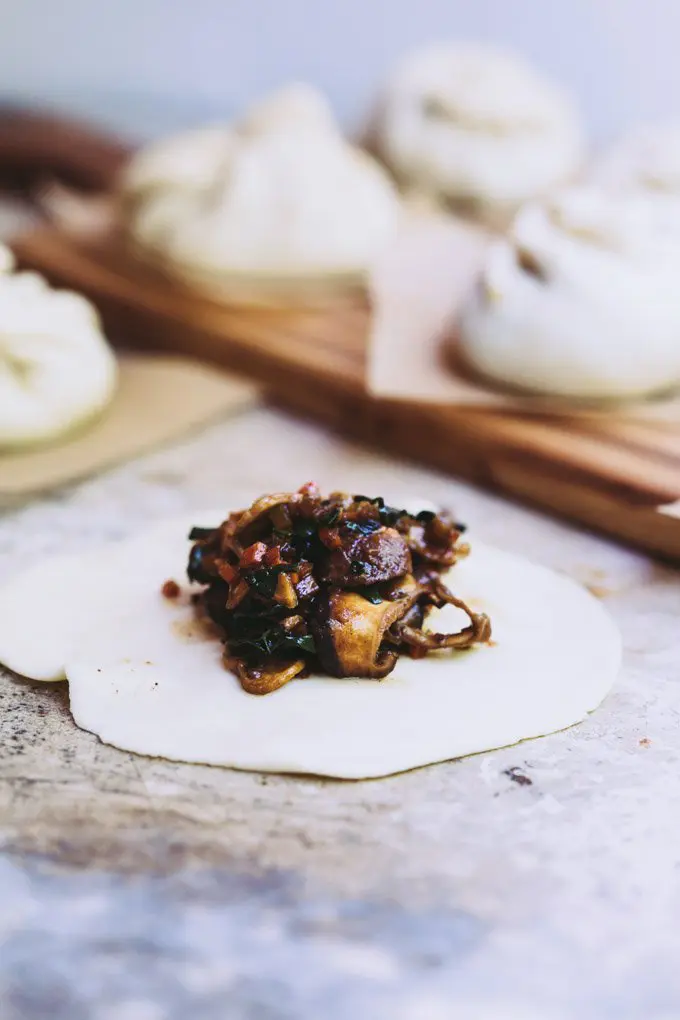 A bao bun on a bench not yet folded