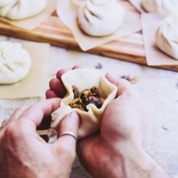 A man making a bao bun