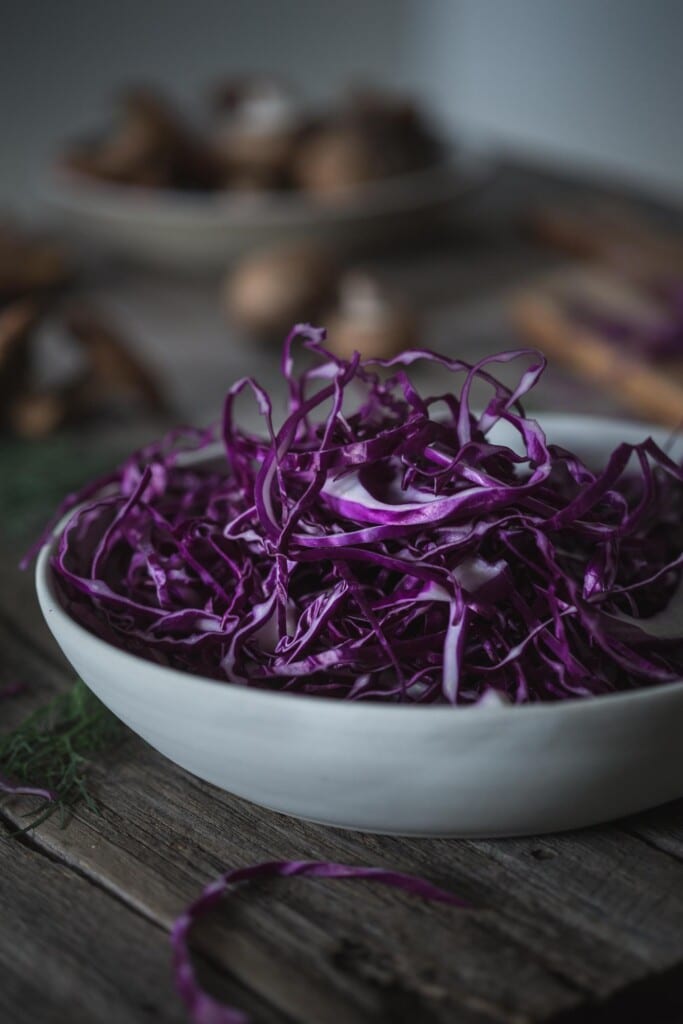 A large bowl of shredded red cabbage