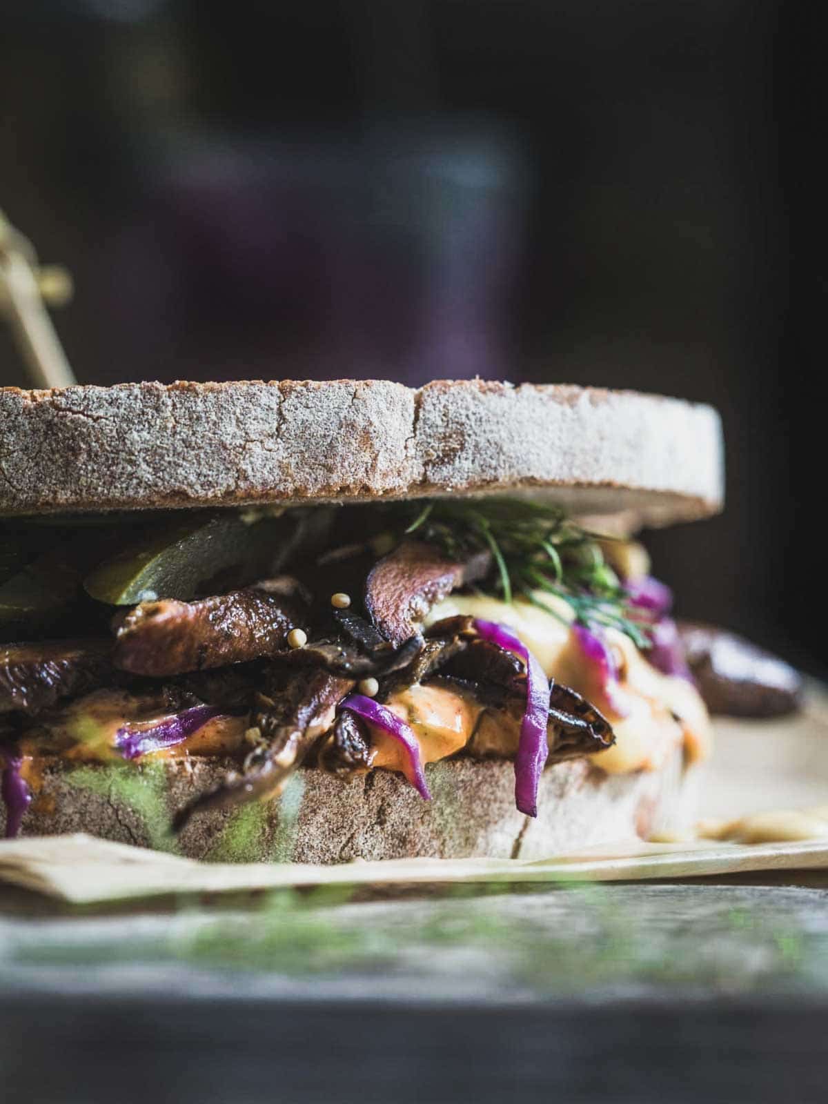 A toasted reuben sandwich close up. 