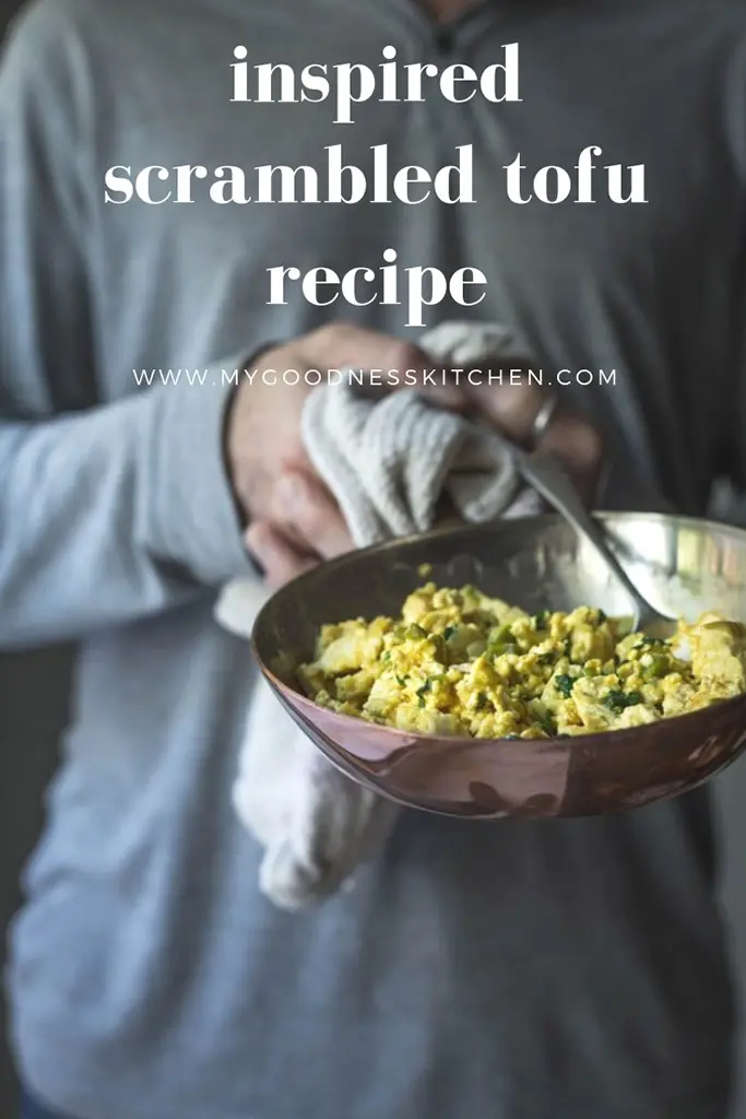 A man holding a skillet of scrambled tofu with text