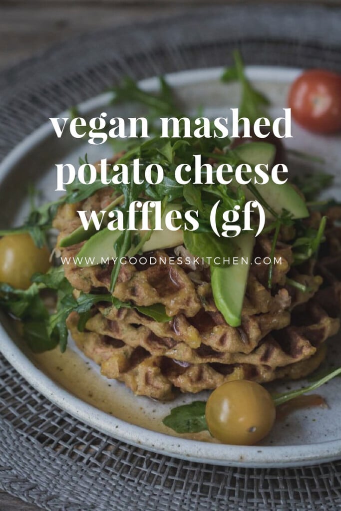 Potato waffles with avocado and greens on white plate with text. 