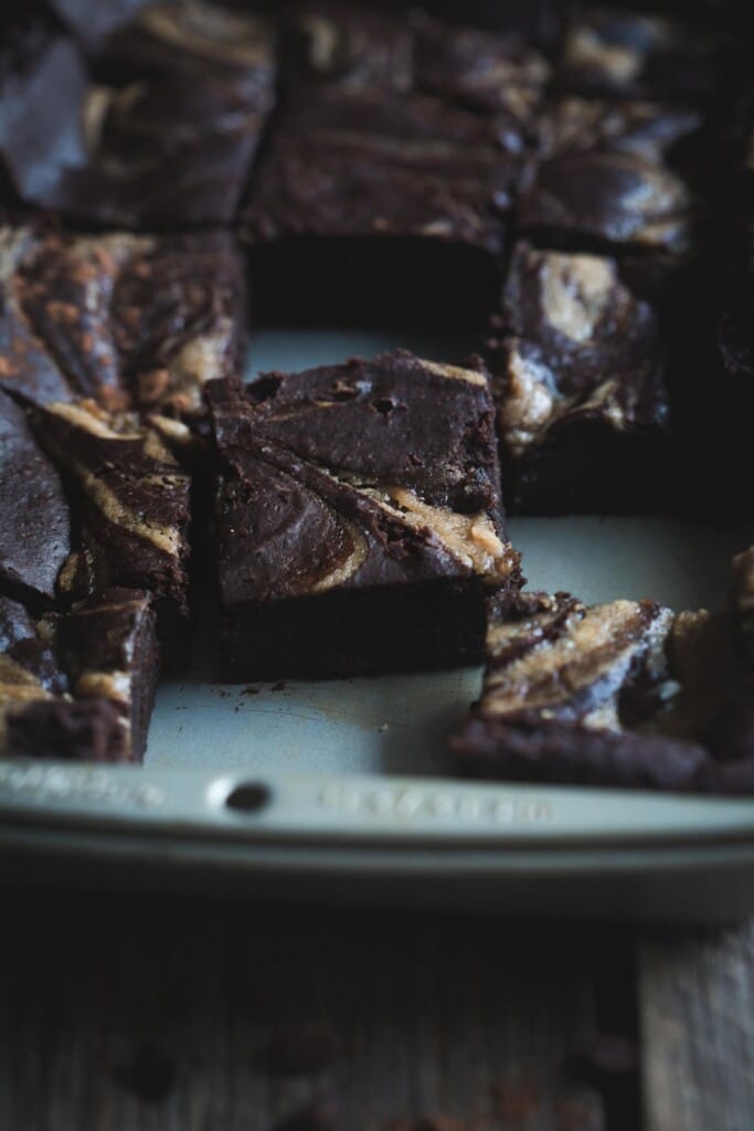 A close-up image of freshly baked black bean brownies in a baking tray.