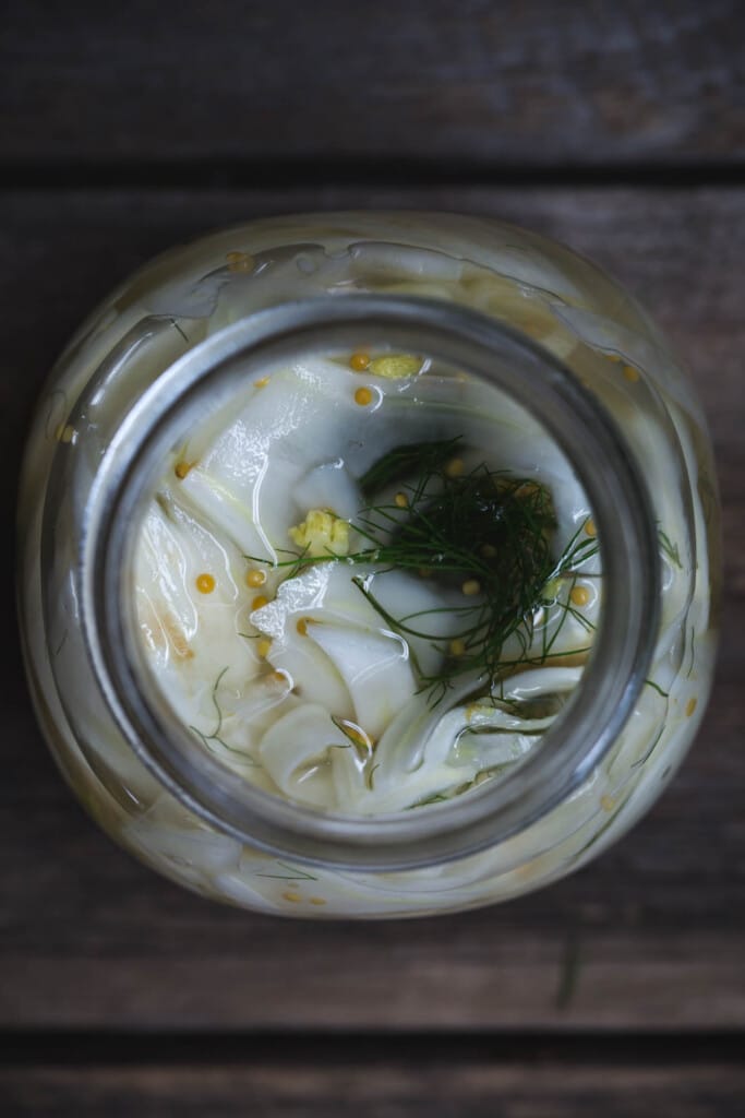 close-up overhead image of the fennel and apple pickles in their pickling jar