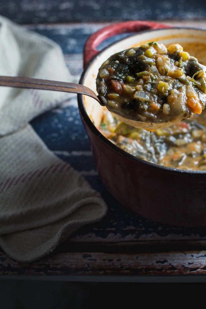 A pot of stew with a ladle