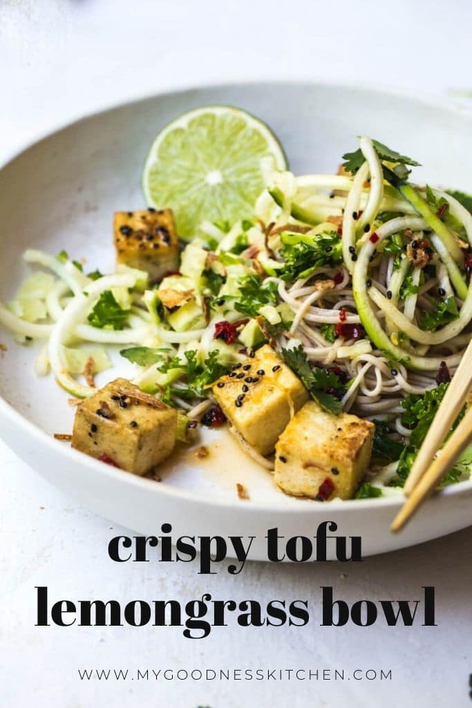 The finished dish -crispy tofu with chilli and lemongrass sauce and zucchini and soba noodles to the side in a white bowl.  Title text overlay in dark grey. 