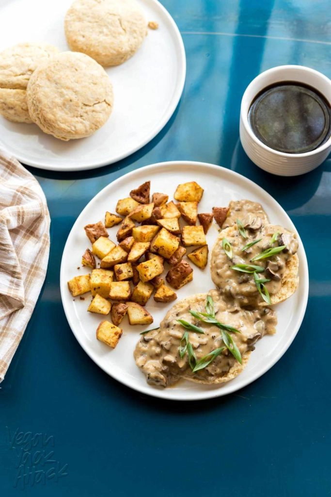 An overhead image of vegan biscuits and gravy with a cup of coffee