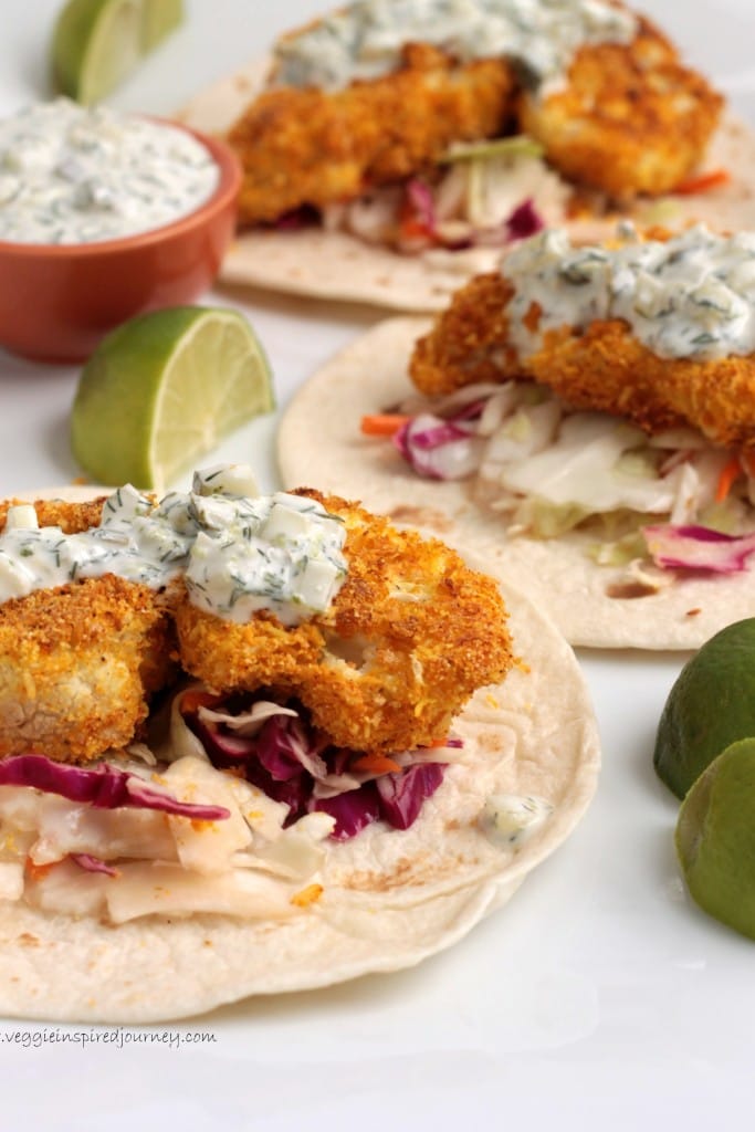 Crispy cauliflower bites sitting on flour tortillas