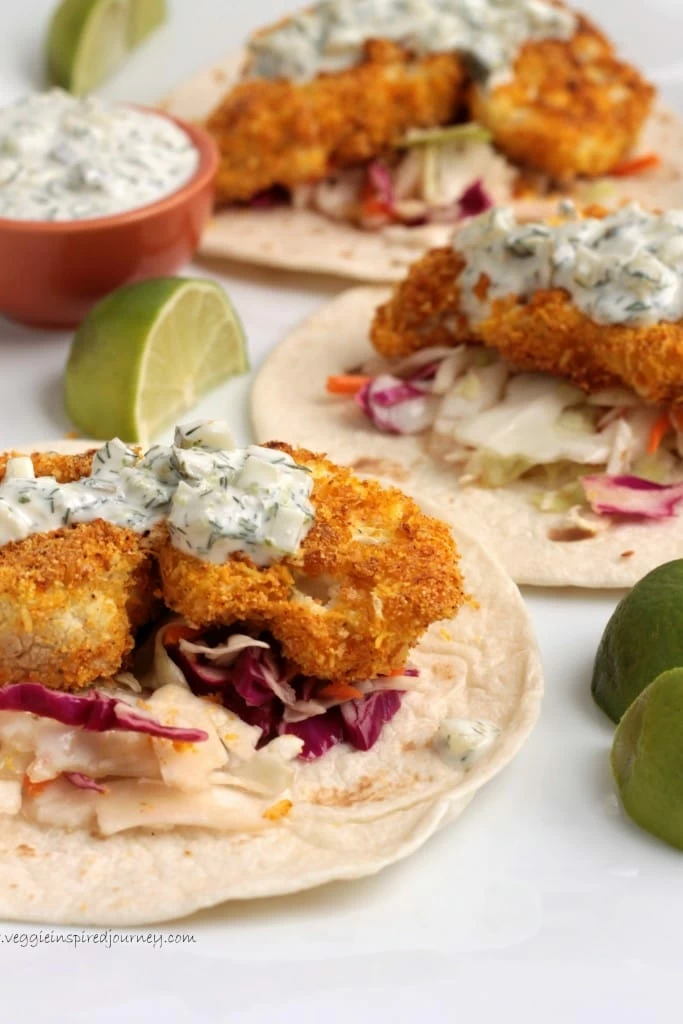 Crispy cauliflower bites sitting on flour tortillas