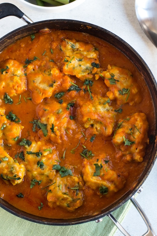 A large pot of chickpea dumplings with sweet potato gravy