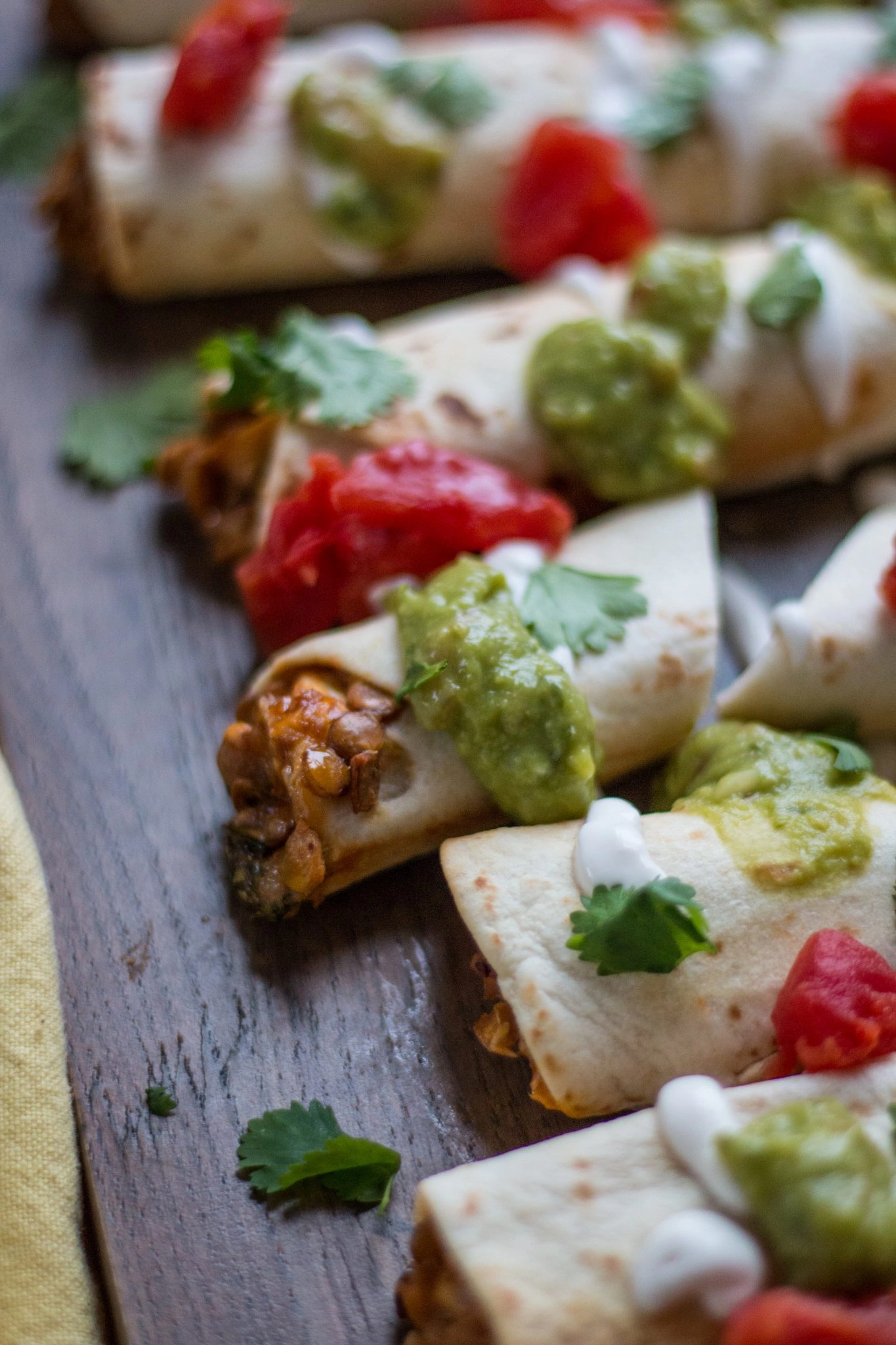 Chipotle Lentil Tasquitos on a wooden board