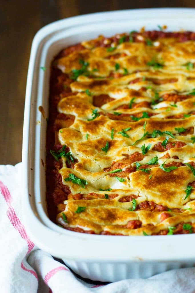 A freshly baked vegan lasagne in a ceramic baking tray