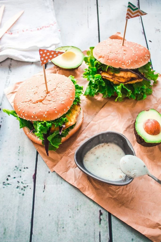 Two oven-baked celeraic cutlet burgers sitting on brown textured paper 