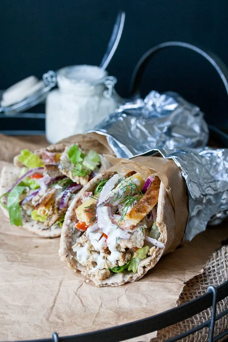 Two vegan Greek Gyros with tempeh on brown parchment