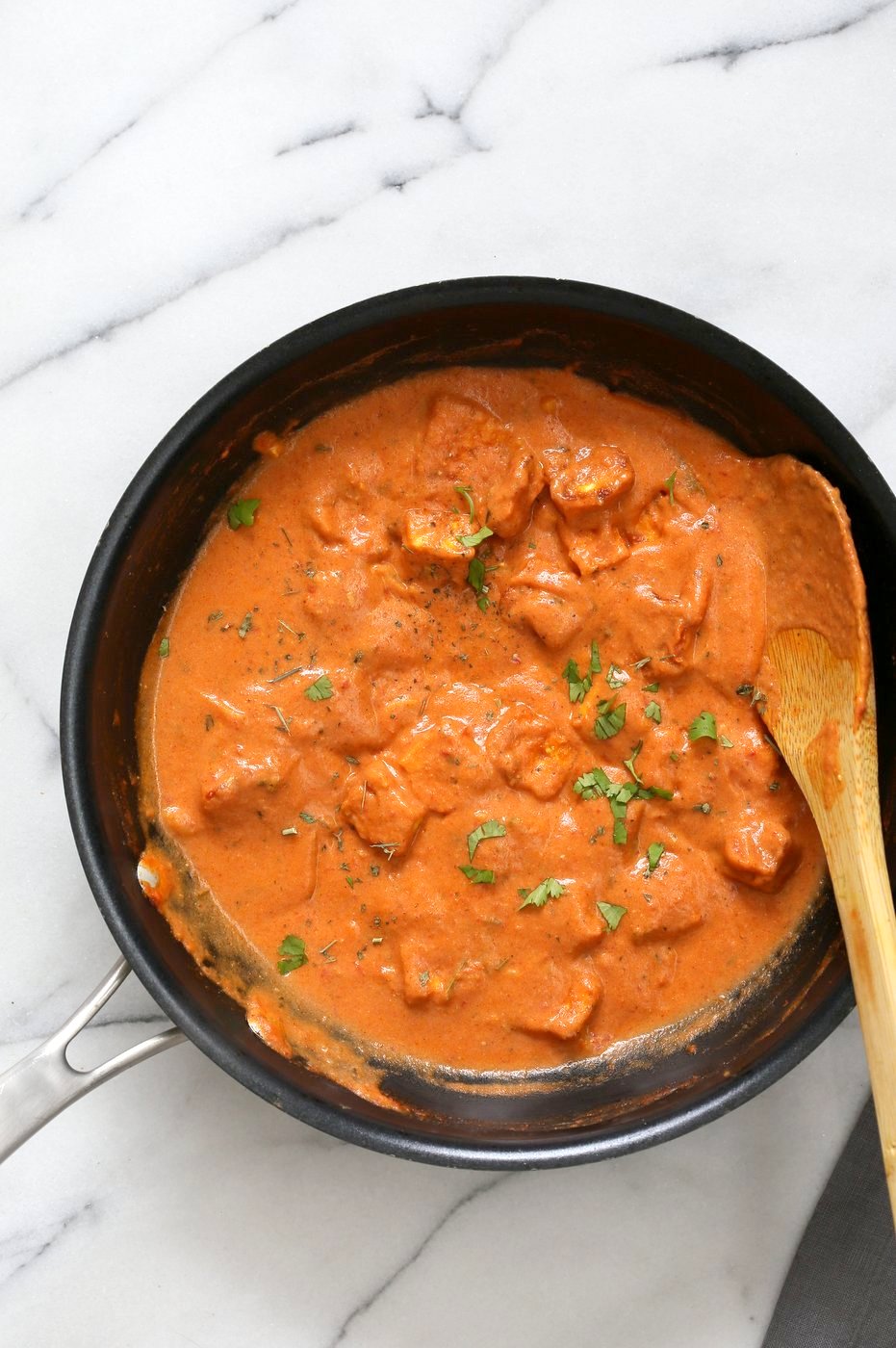 An overhead image of a pan of tofu butter Indian paneer