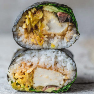 A close up of a sushi burrito