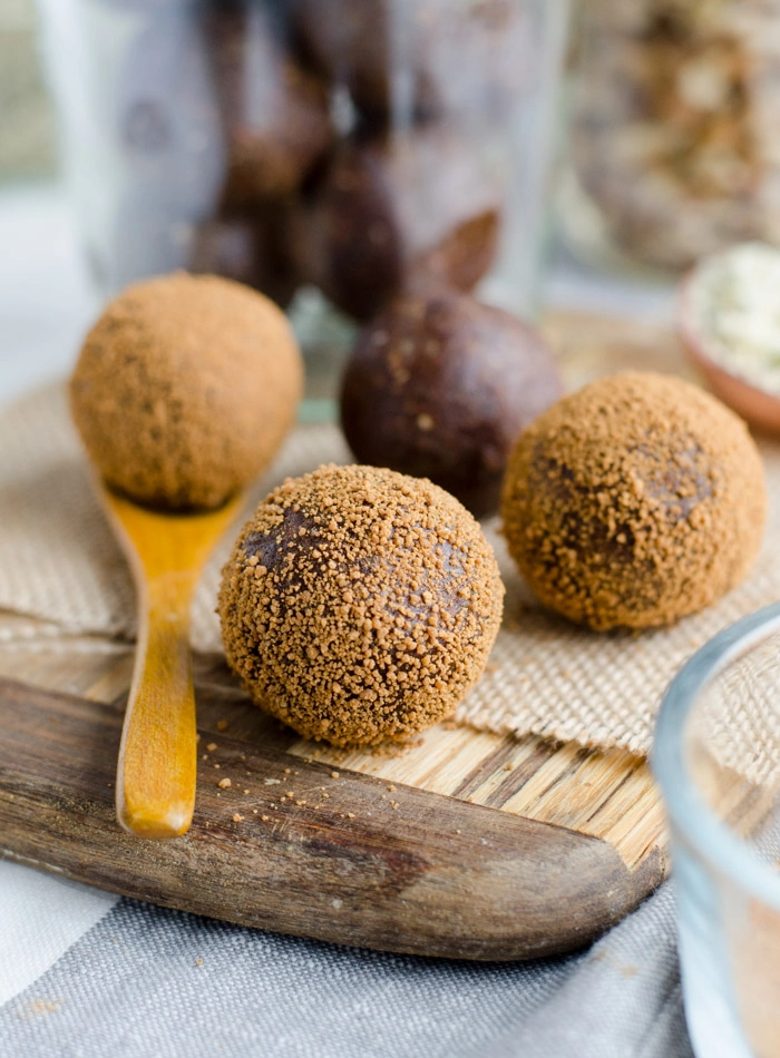 Snack balls on a wooden board.