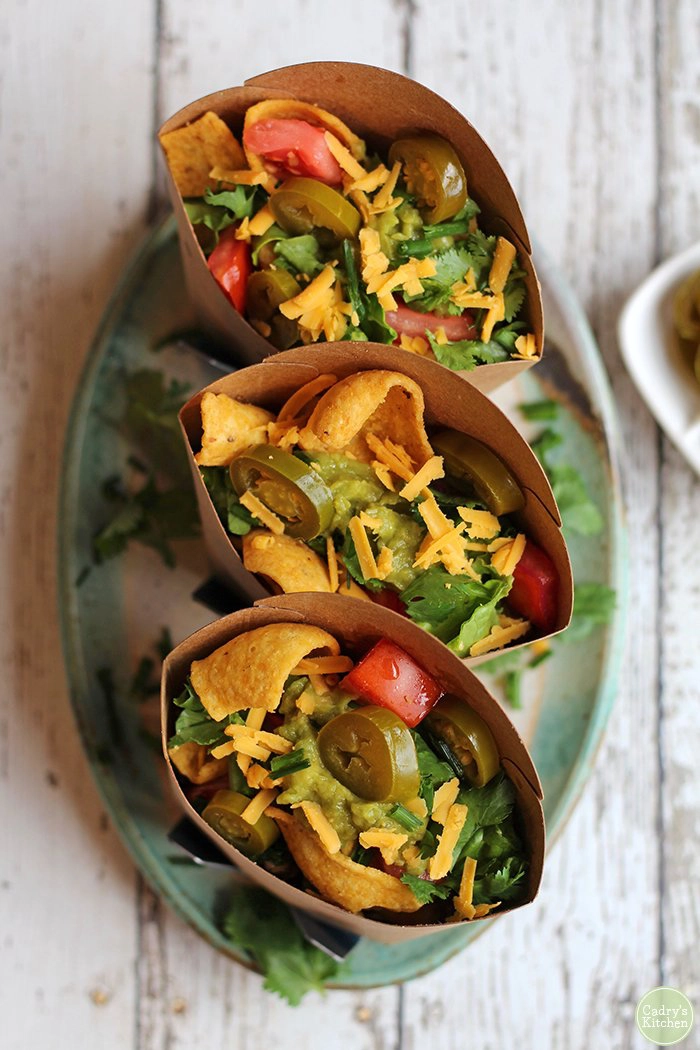 Serving boxes filled with Mexican food. 