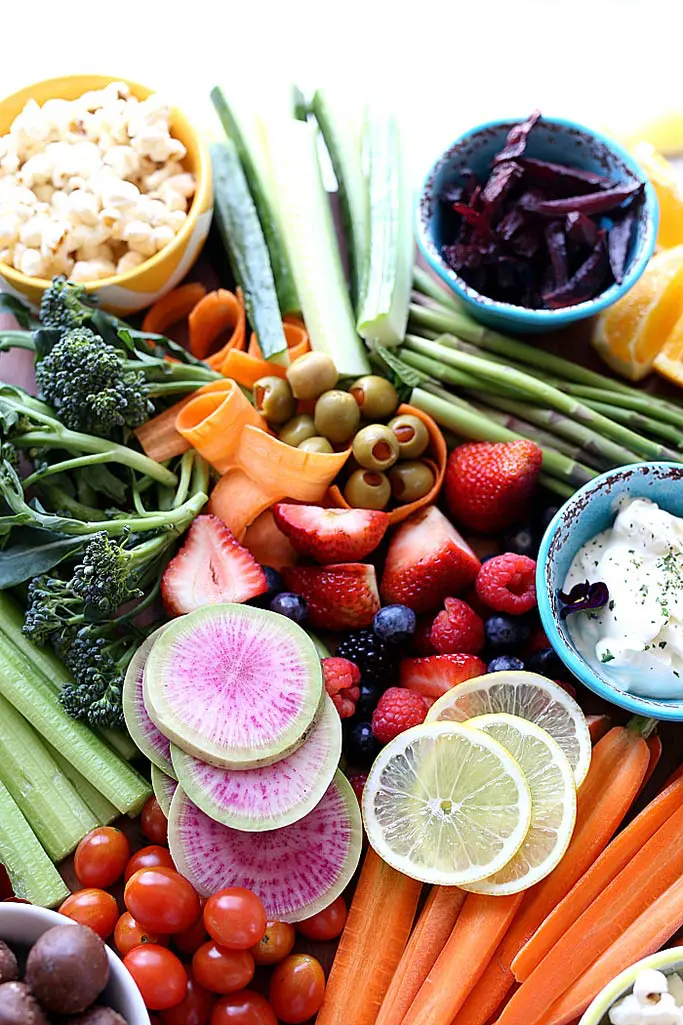 A platter of fresh fruit and vegetables.