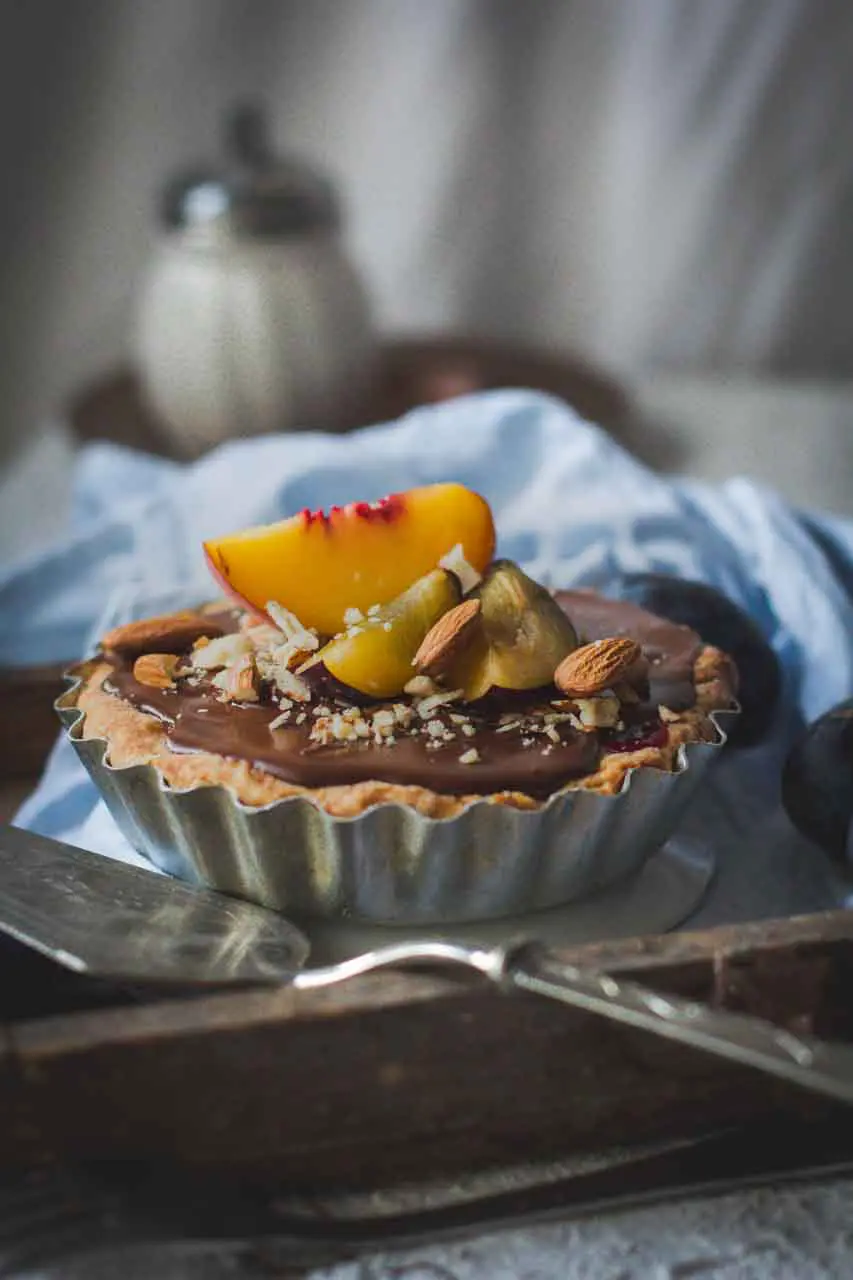 A chocolate tart with fruit.