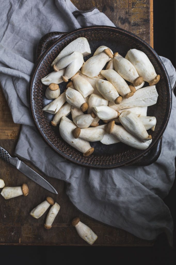 overhead image of a bowl of oyster mushrooms