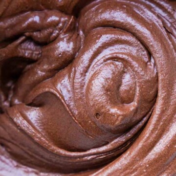A close up of a swirl of chocolate frosting
