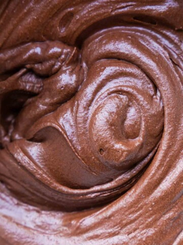 A close up of a swirl of chocolate frosting