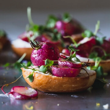 A close up of a plate of bagels with roast radish
