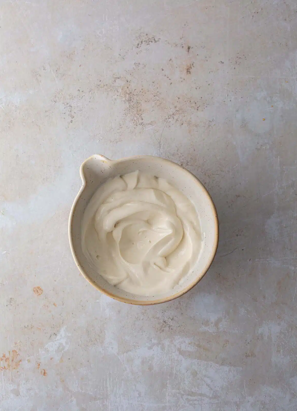 A bowl of plant-based mayonnaise.