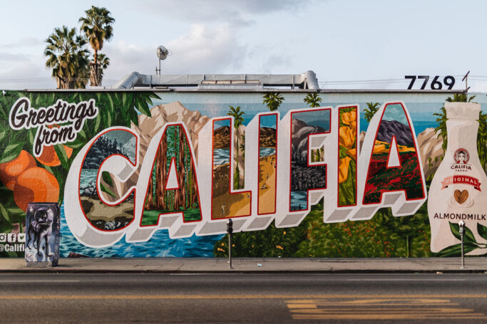 An advertisement for almond milk painted on a wall