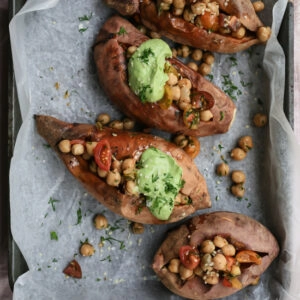 Overhead image of Herbed Chickpea Stuffed Sweet Potatoes on a tray