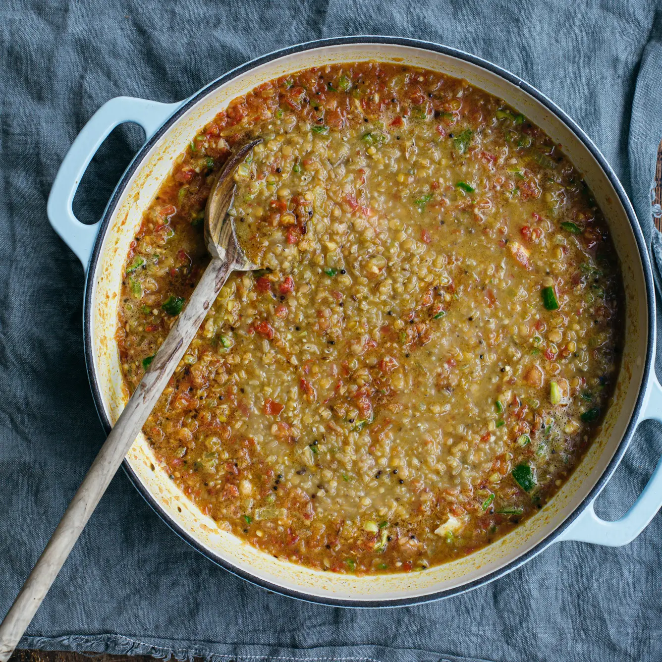 A pan of cooked red lentil dal.