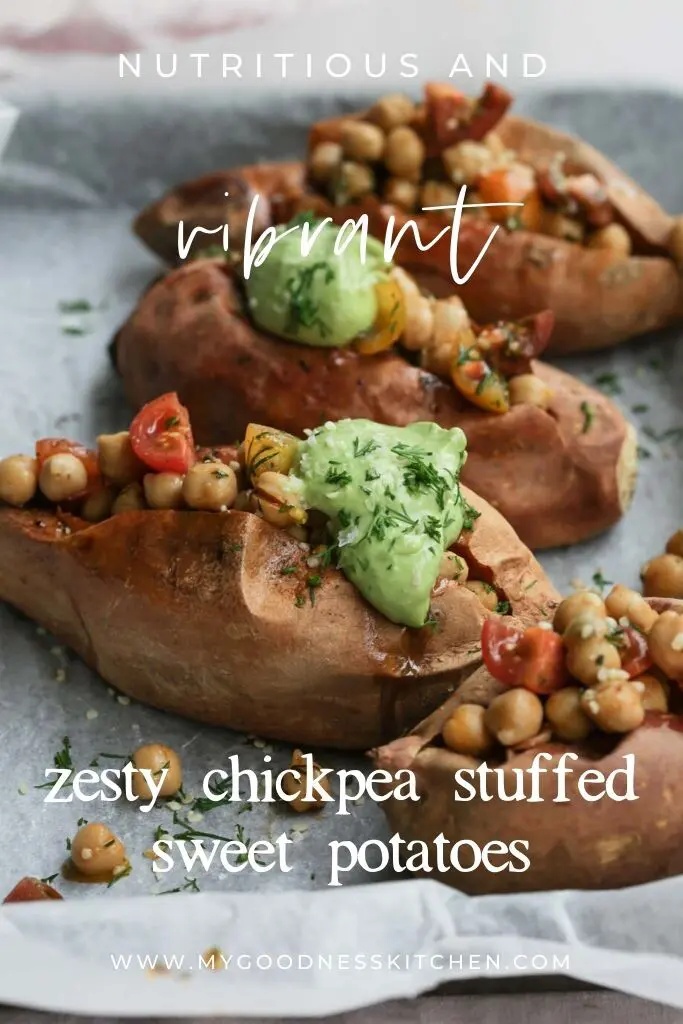 Close up image of freshly three prepared chickpea stuffed sweet potatoes on a lined baking tray with the recipe title overlaid. 