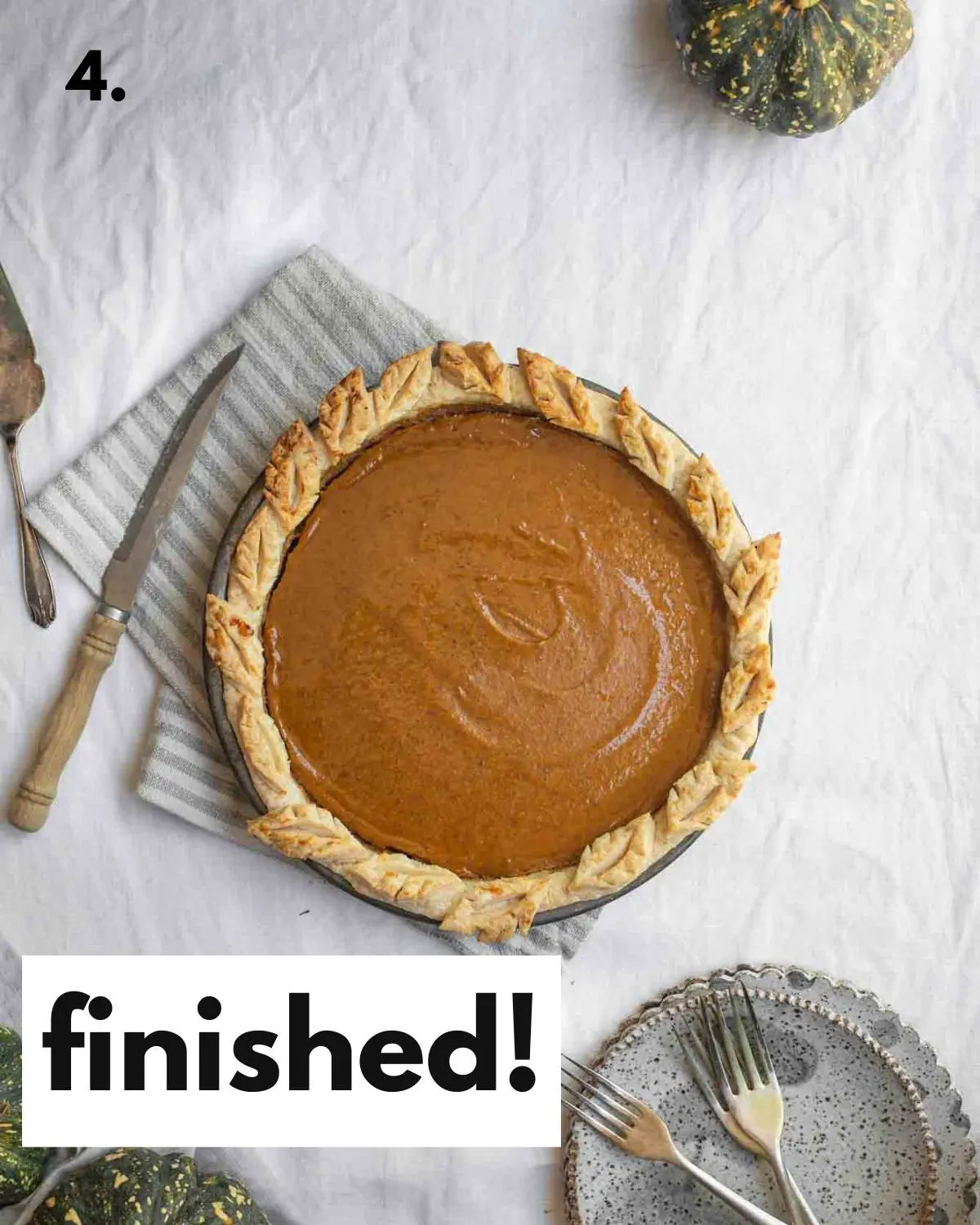 Finished pumpkin pie sitting on a table.