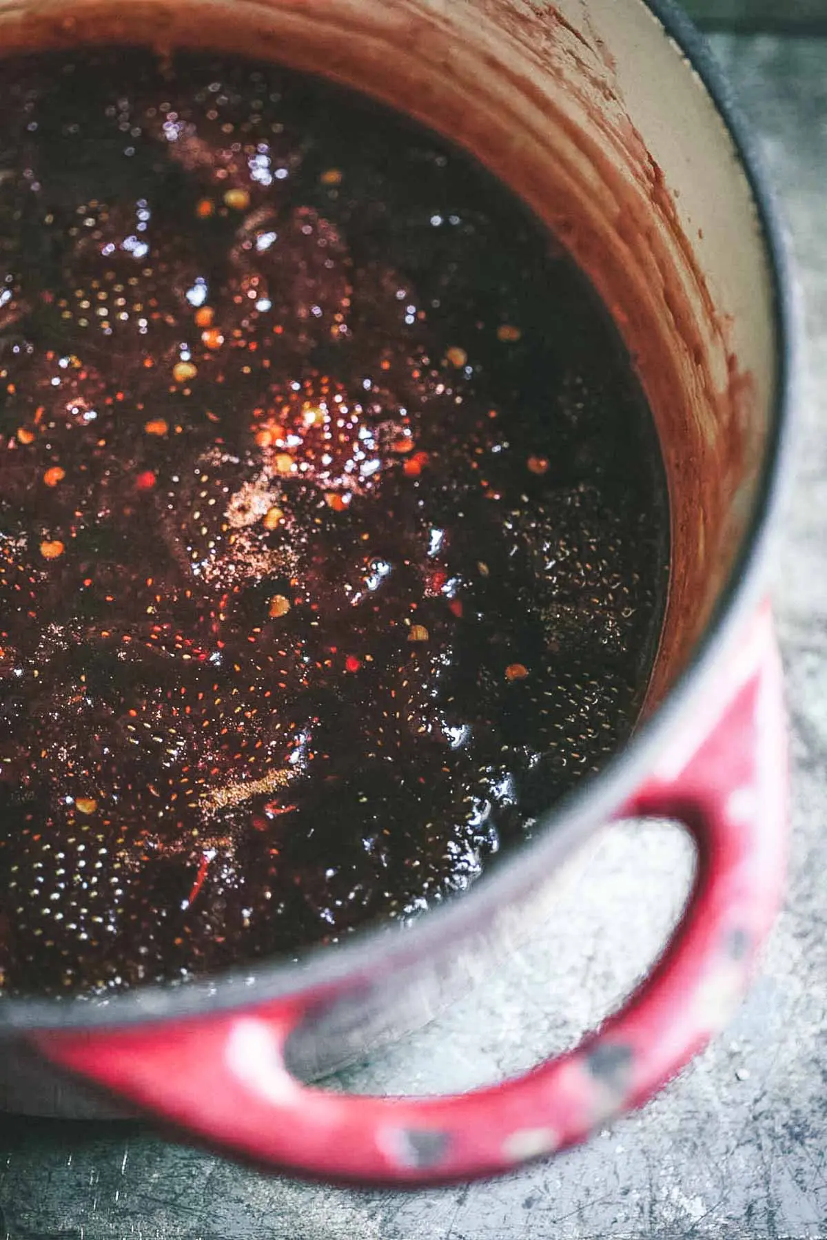 A close up image of a pot of jam cooking. 