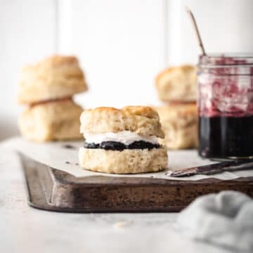 Freshly baked scones with jam and cream.