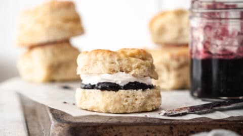 Freshly baked scones with jam and cream.