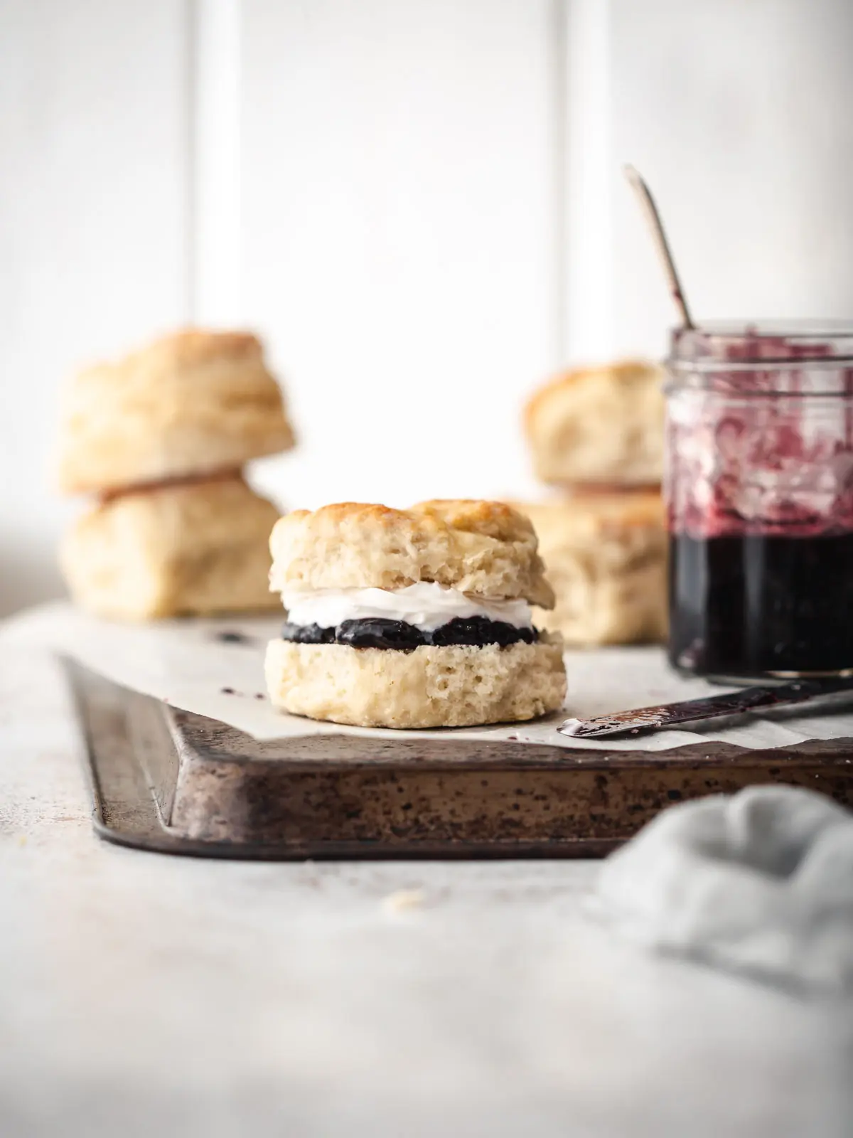 Freshly baked scones with jam and cream.