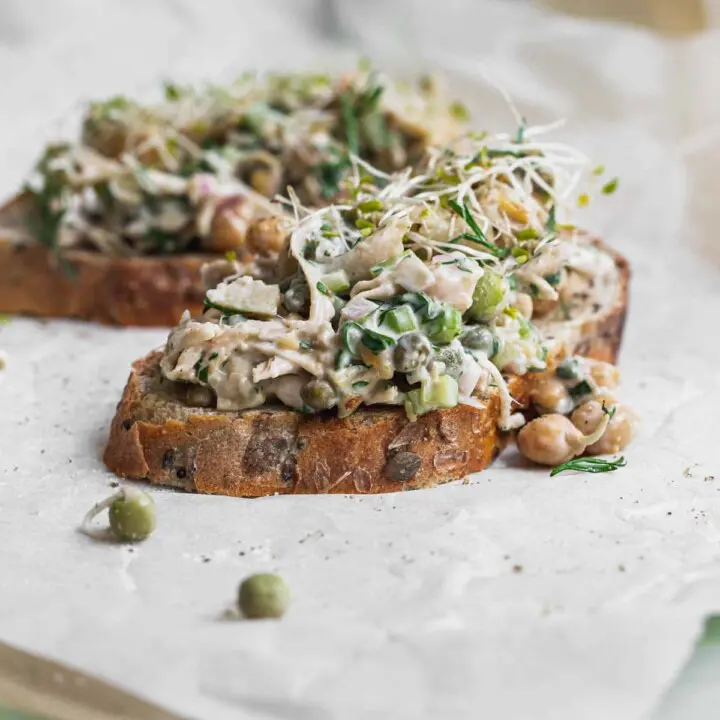 Two slices of bread topped with a salad.