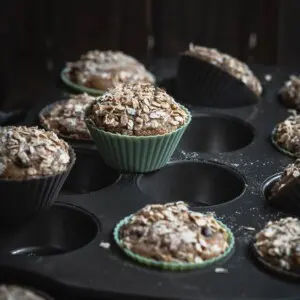 Zucchini muffins in a baking tray.