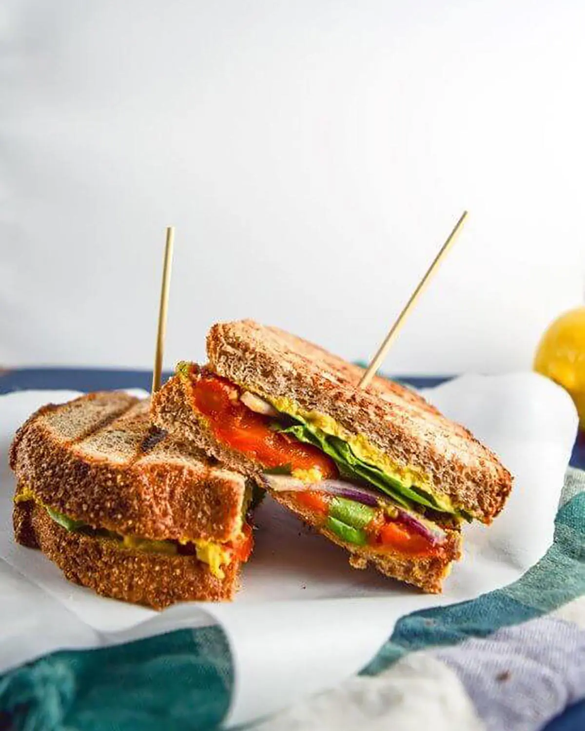 A colourful sandwich on kitchen paper.