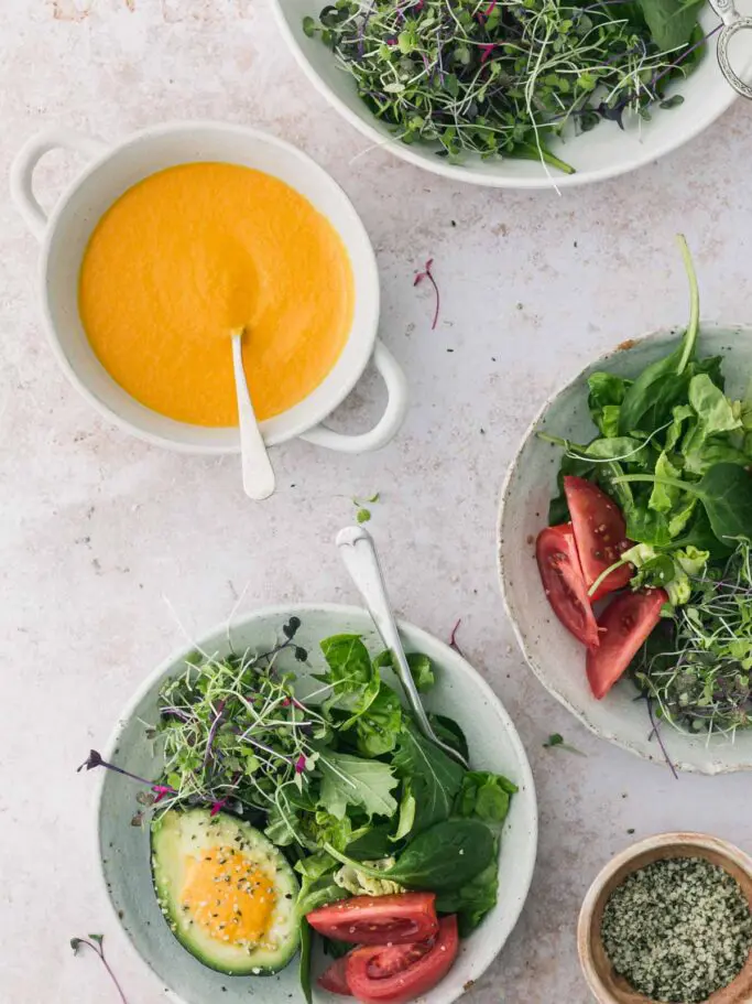 Bowls of salad with dressing.