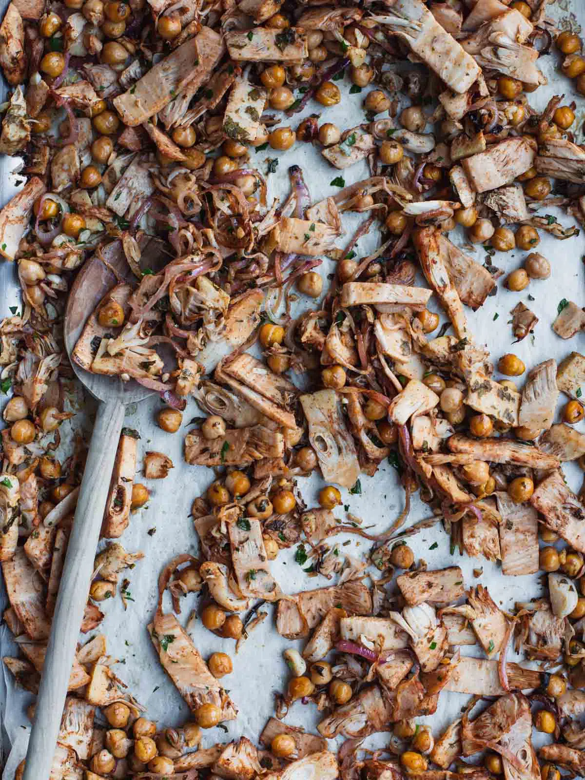 A tray of roasted jackfruit on baking paper. 