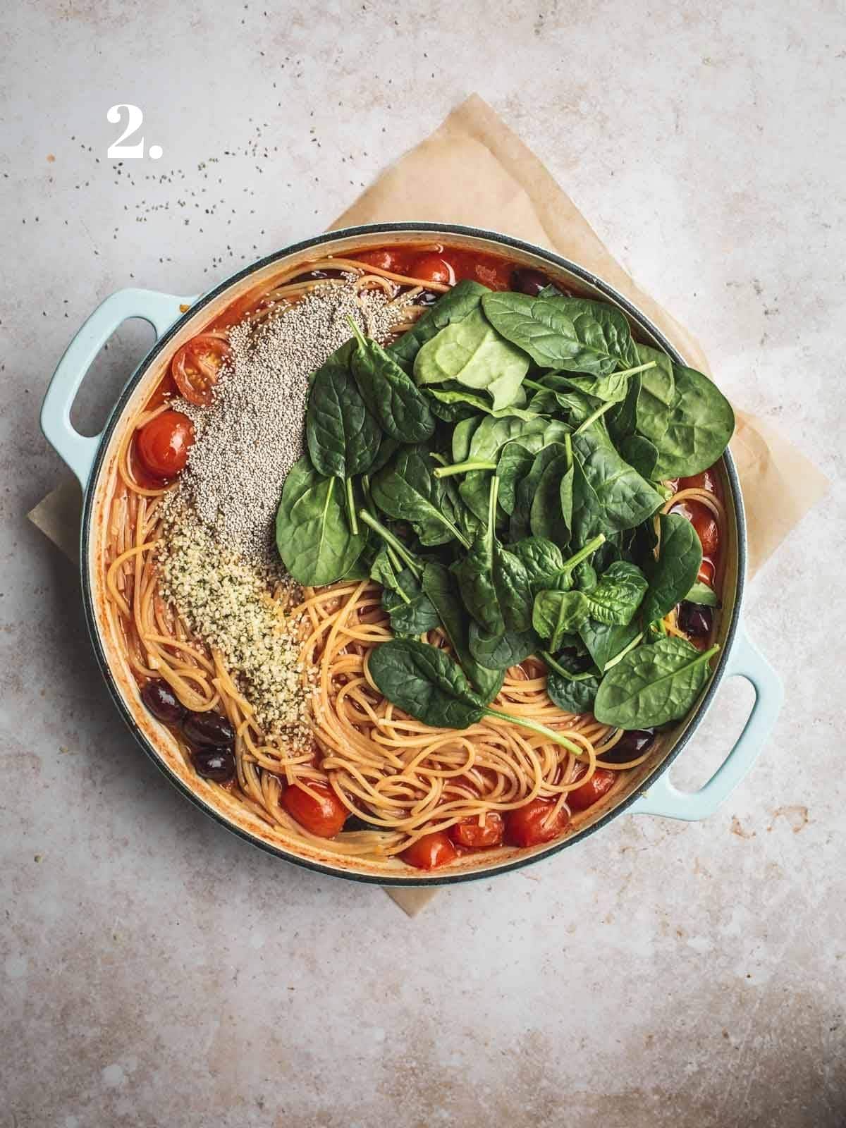 Tomato spaghetti cooked in a large pot. 
