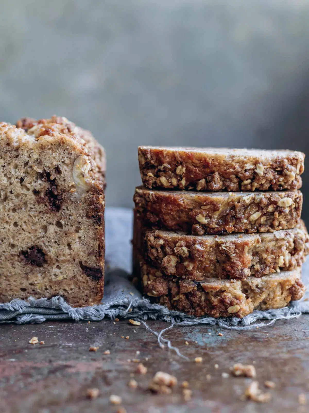 A stack of banana bread slices on a wooden table.
