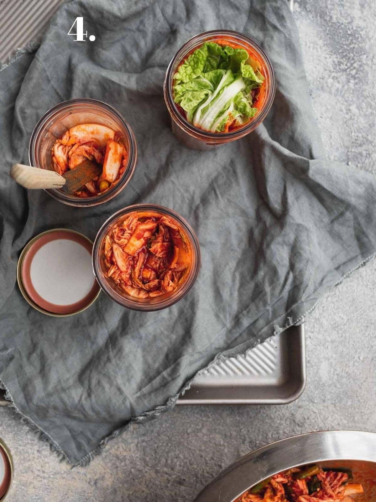 Kimchi being packed in to jars.